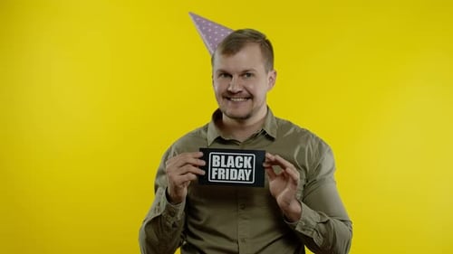 Man Promotes Black Friday Sale with Party Hat