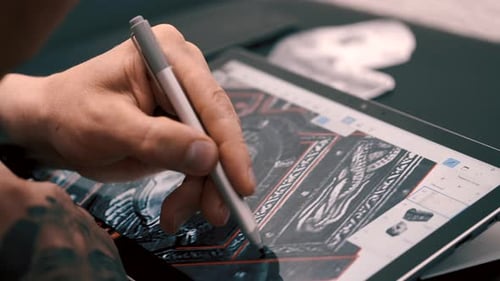 Tattoo Artist Tracing Image for New Tattoovin the Studio