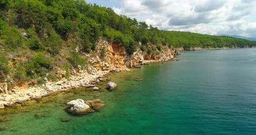 Picturesque Coastline with Turquoise Waters and Green Cliffs
