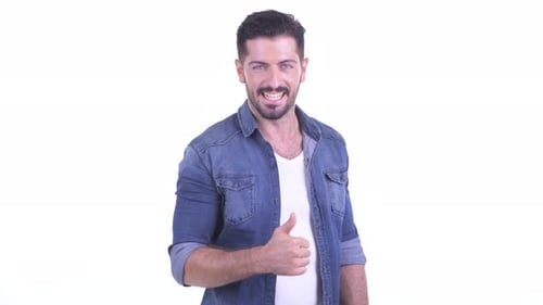 Man Smiling Gives Thumbs Up Gesture