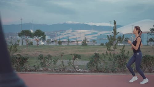 Sportwoman Jogging in Park.