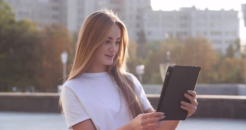 Beautiful Caucasian Joyful Woman Wear Headphones Speaking on Video Call on Device Online