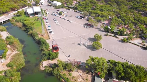 Close-up Flight Next To the Uphill Funicular with the Coast in the Background