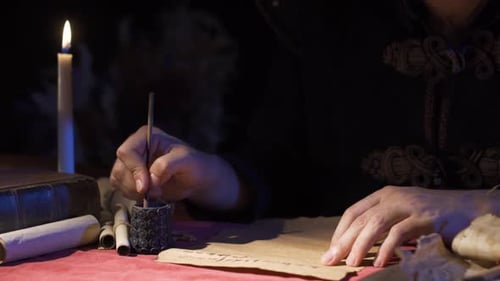 Man Writes with Quill Pen by Candlelight