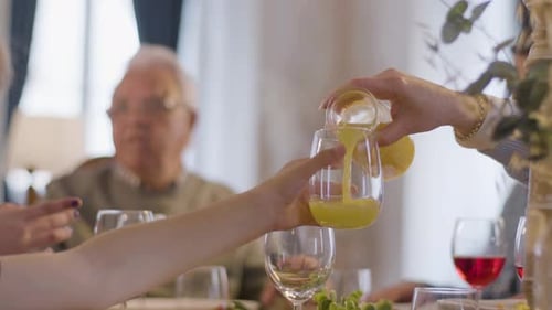 Family Dinner, Senior Man, Juice Being Poured