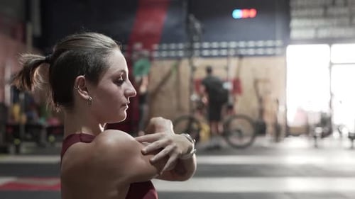 Sportswoman stretching in gym