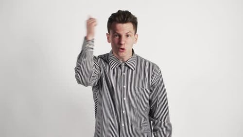 A Young Guy in a Shirt Caucasian Appearance Shows Discontent