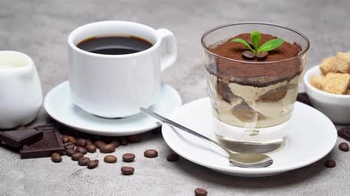 Classic Tiramisu Dessert in a Glass, Coffee, Chocolate, Cream and Sugar on Concrete Background
