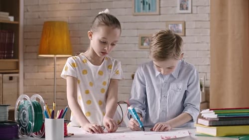 Children Creating with 3D Pen at Table