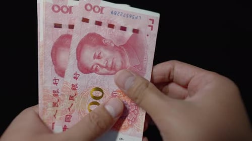 Counting Chinese Currency Bank Notes Close Up