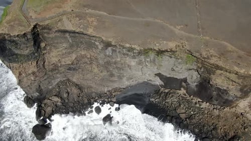 Aerial view of Dyrholaey peninsula next to Reynisfjara beach in Iceland