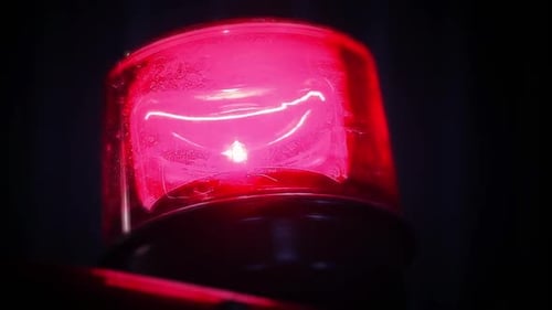 Red Emergency Siren Spinning in the Dark