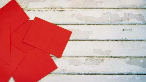 Red Envelopes on Distressed White Wood Background