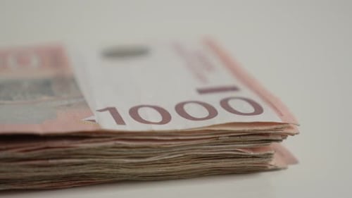 Lot of Serbian banknotes on pile close-up 4K 2160p 30fps UltraHD tilting footage - Paper denominati