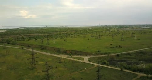 Flying Near Large Power Line Pylons Near The Road