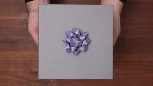 Holding a Gift in Hand