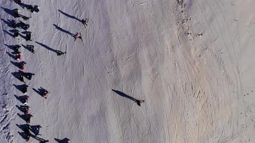 Aerial flight above mountain ski resort Сable car lifts in