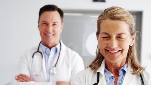 Smiling Doctors in Hospital Setting