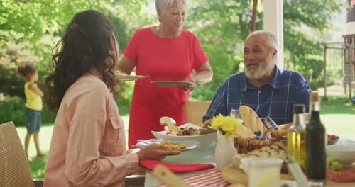 Multi-generation African American family spending time in garden together