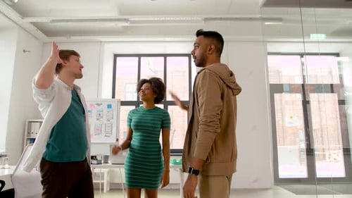Happy Creative Team Making High Five at Office