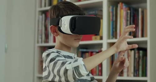 Young Boy Exploring Virtual Reality with VR Headset