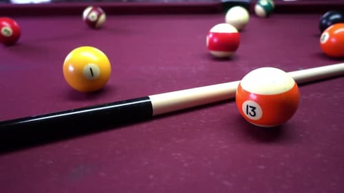 Billiard balls with numbers on a pool table