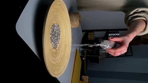 Hands Arranging Stones on Crafting Table