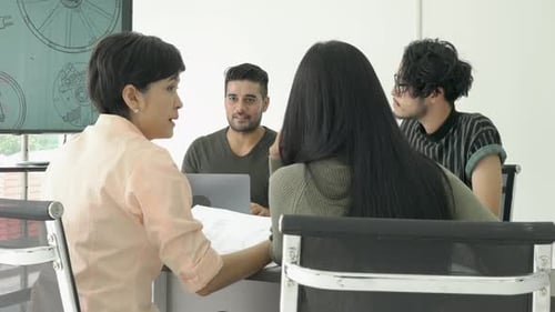 Team Meeting in Modern Corporate Workplace