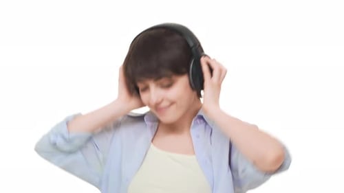 Young Adult Dancing with Headphones on White