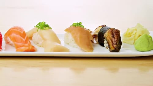 Camera Moves Pass A Plate Of Sushi
