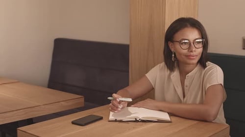 Woman Writing Down Ideas