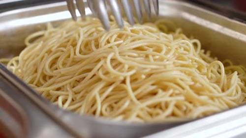 Buttered Noodles in a Silver Container Close Up
