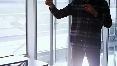 Man Using Virtual Reality Headset in Office
