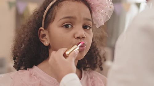 Child Gets Lip Gloss Applied for Birthday