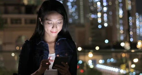 Woman Reading on Mobile Phone