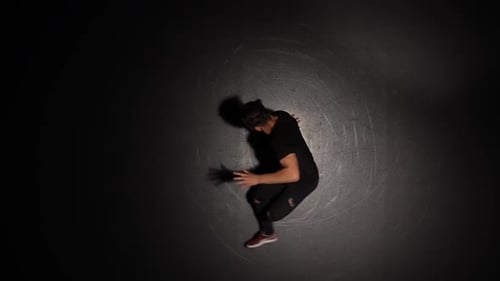 Talented Young Break Dancer. Hip Hop Street Dance on a Stage in Front of the Spotlight. Top View