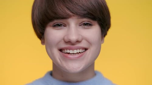 Portrait of Caucasian Woman Smiling Sincerely at Studio
