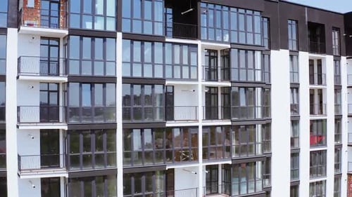 Aerial view of the facade of new residential complex in minimalist style