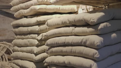 Bright Pillows Towels Plaids Blankets and Other Home Wear on Shelves Shop Supermarket