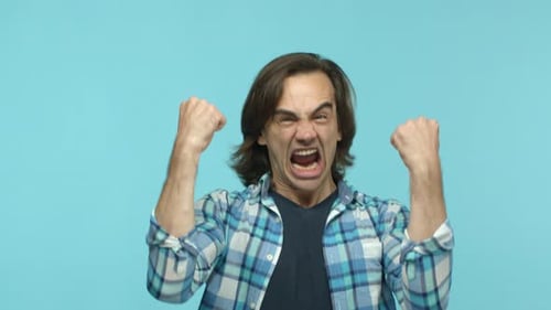 Angry Man Yelling and Punching Forward