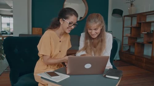 Two Girls Meet in a Coffee Shop