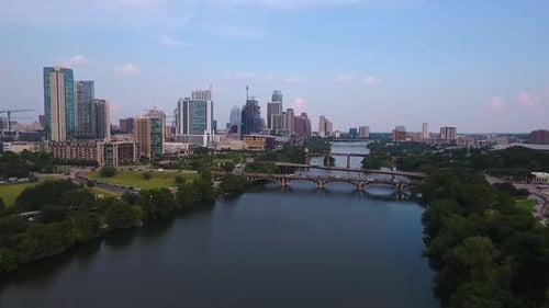 AERIAL: Drone pushing in and rising up on downtown Austin, Texas on a beautiful sunny day.