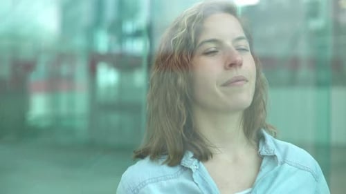 Woman gazing through window