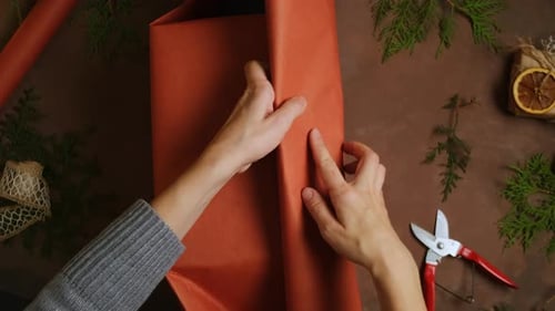 Gift Wrapping With Paper and Evergreen Branches