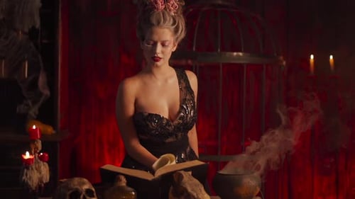 Glamorous Young Woman Casting Spell with Cauldron