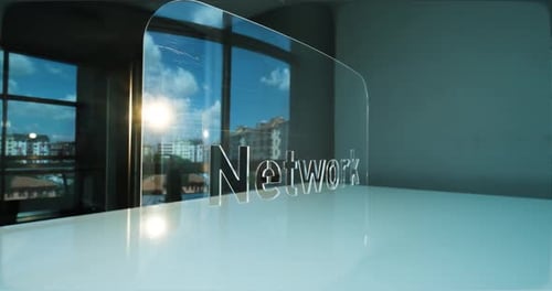 Glass Network Letters and Office in Background