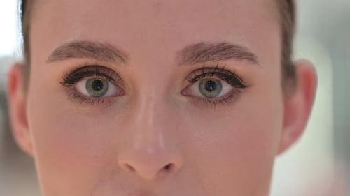 Close Up of Blinking Eyes of Young Woman
