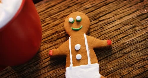Gingerbread Man and a Mug on Wooden Table