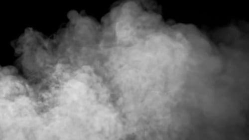 Billowing Smoke Cloud Rising on Black Background