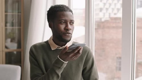 Young Adult Using Voice Command on Phone